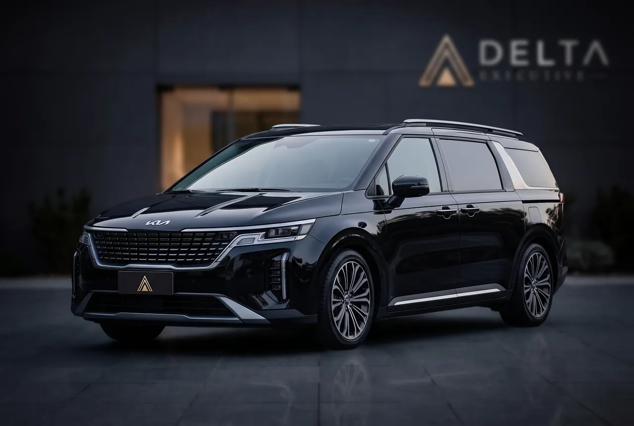 Kia Carnival preta, a minivan que a Delta Executive usa em atendimento VIP e grupo pequeno